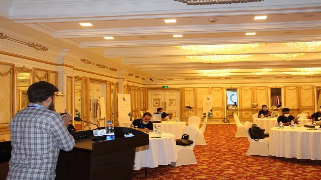 KRATOS instructor delivering a training session to participants in a conference hall